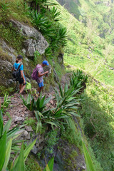 Poster - guide and client hiking through wild jungle and mountain landscape in the Cape Verde Islands