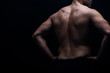 © LIGHTFIELD STUDIOS - partial view of sexy bodybuilder with muscular back posing isolated on black