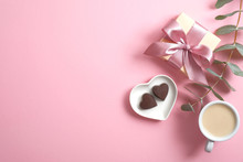Romantic Valentine's Day Composition With Cup Of Coffee, Gift Box, Sweet Heart Shaped Candy On Pink Background. Flat Lay, Top View, Copy Space.