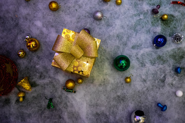 A gift box used to decorate a Christmas scene.