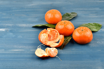 Wall Mural - Ripe gorgeous tangerines with leaves	