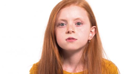 portrait shot of disappointed girl with deep green eyes looking attentively at camera. isolated, on 