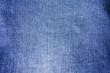 © Iryna - navy jeans fabric plain surface background, denim textile texture