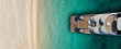 © aerial-drone - Aerial drone top view ultra wide photo of luxury yacht docked near exotic sandy turquoise beach