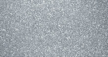 Silver Glitter Background, Sparkling Shimmer Glow Particles Texture. Silver Light Sparks And Glittering Foil Sequins Background With Shine Sparks Glare