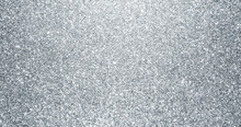 Silver Glitter Background With Sparkling Texture. Silver Shimmering Light, Stars Sequins Sparks And Glittering Glow Foil Background
