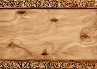 Wooden frame with pattern of flower carved on wood.