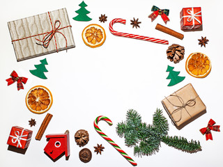 Wall Mural - Flat lay christmas pattern, gifts, tree, oranges, decorations, sweets, toys, candy cane on white background, copyspace