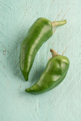 green chili peppers on a wooden table