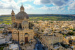 Aerial view of Rotunda St. John Baptist Church. Countryside of Gozo island, cloudy blue sky. Malta 