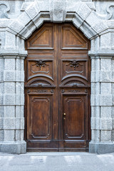 ancient wooden door of entrance building, Europe