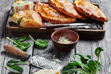 Wall Mural - close-up of calzones wth Spinach and Cheese