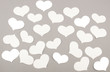 © suharik - White paper hearts on grey background