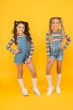 © be free - Hip and stylish. best friends forever. small sisters have fun. little girls yellow background. hairdresser salon. kid summer fashion. beauty and style. childhood happiness. happy school friendship