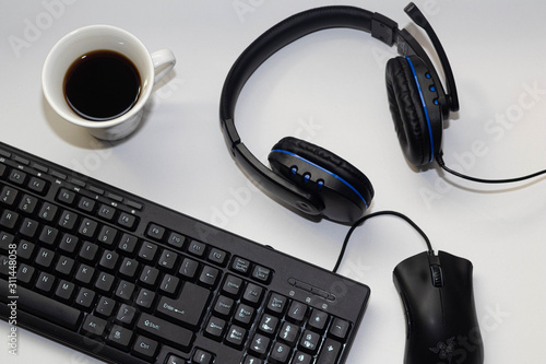 Fotomural work items in the office, mouse, keyboard, headset to hear that music to cheer up and a cafe to give strength