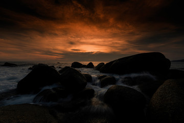 Wall Mural - Beautiful Seascape with sea and rock on sunset background..