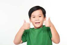Very Happy Asian Boy Making Thumbs Up Sign With Hands Laughing Happily (Asian Ethnicity Boy Isolated On White Background)