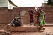 African Children Fetching Drinking Water At Their Modern Village Water Pump