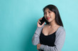 © halfbottle - Young Asian woman talking with mobile phone.