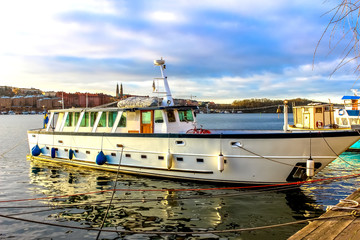 Wall Mural - Ships at the pier in the Scandinavian fjords in the rays of the rising sun