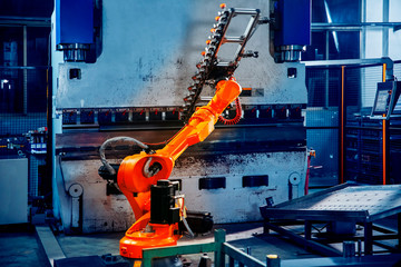 Robotic arm on heavy factory assembly line is moving