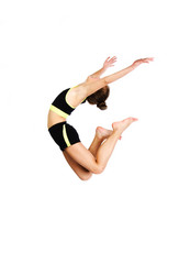 Wall Mural - Flexible cute little girl child gymnast jumping and having fun isolated on a white background