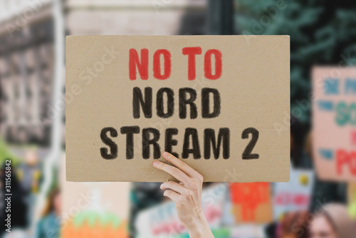 The phrase No to Nord Stream 2 on a banner in men's hand Tableau sur Toile