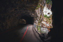 Dark Tunnel With A Hole In A Rock In The Mountains Of Taroko National Park