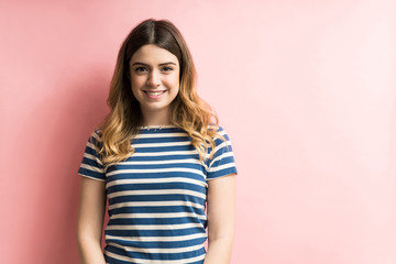 Wall Mural - Happy Female Smiling Against Colored Background