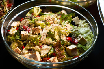 Veggie salad with cheese lettuce leaves fresh paprika tomatoes, close-up