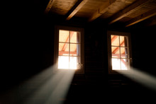 Basement Windows In Wooden Cabin House. Light Beams Passing Through Them