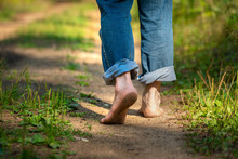 Man Walking In Park. Close-up Of Bare Feet Soiled With Ground. Healthy Lifestyle.