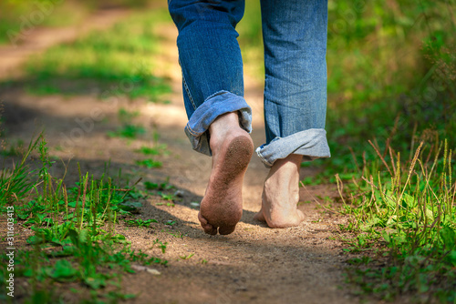 Fotografía Man walking on footpath forest