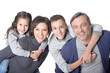 © aletia2011 - Portrait of happy smiling family of four posing together on white