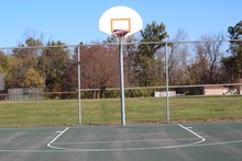 The Basketball Hoop Court In The Park On A Sunny Day. 