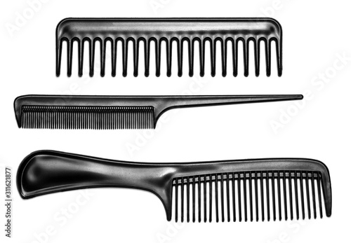 Fotomural Black hair combs isolated on a white background