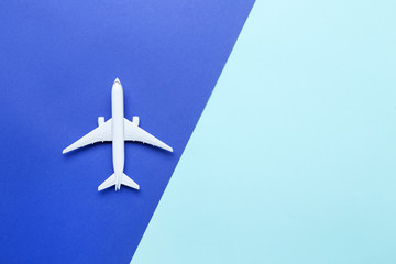 Airplane model on colorful paper background