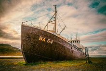 An Out-of-the-way Whaling Ship That Rusts On The Road To Latrabjarg On A Dead Cloudy Day. The Shipwreck Has The Identification BA 64 And Is Located On A Beach In The West Of Iceland