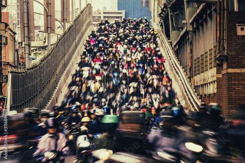 Cuadros en Lienzo Chaos/ The crowd of people are riding scooter, shot with slow shuttle speed like