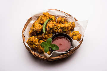 Wall Mural - Crispy Corn pakora/pakoda, bhajji, Bhaji, bajji or pattice . served with tomato ketchup