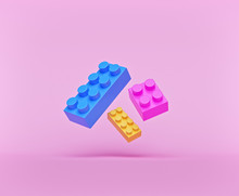 Plastic Toy Blocks Isolated On Pastel Pink Background. Levitation Concept. 3d Rendering