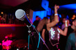© Семен Саливанчук - microphone against blur on beverage in pub and restaurant background.