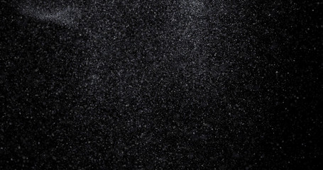 Wall Mural - Natural white winter snowfall on a black background