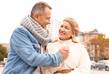 Sticker - Portrait of happy mature couple outdoors on autumn day