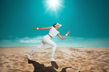 Wall Mural - Athlete runner. Sporty and fit woman running on the sky background. The concept of a healthy lifestyle and sport. Girl in white sportswear.
