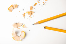 Broken Pencil And Shavings On White Background, Top View