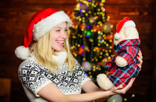 All She Wants For Christmas. Cheerful Woman. Xmas Mood. Woman Got Teddy Bear Toy Present. Santa Hat Christmas Accessory. Cute Gift. Winter Holidays Celebration. Happy New Year. Christmas Preparation