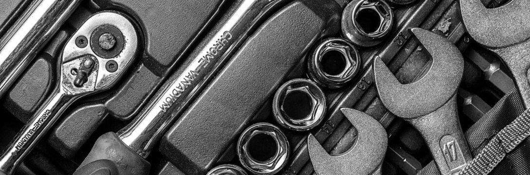 Fototapete -  - Black and white men tools background. Worker tools and  equipments close-up. Panoramic banner.