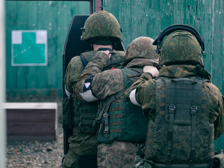 Wall Mural - The storming of the premises at the special forces training ground with shields