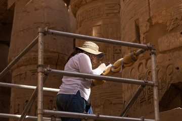 karnak temple, complex of amun-re. embossed hieroglyphics on columns. great hypostyle hall. a french